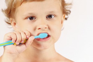 brush with fluoride toothpaste