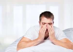 Exhausted Man Living with the Dangers of Sleep Apnea